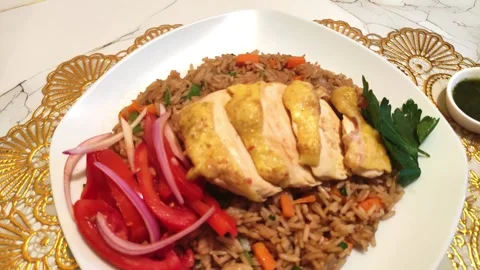 Peruvian fried chicken with rice and tomato salad called "Pollo con arroz". Stock Footage 285361686