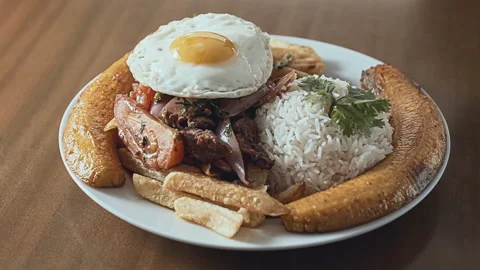 Peruvian Lomo Saltado Dish with Beef Fries,Rice and Plantain. Stock Footage 338341760