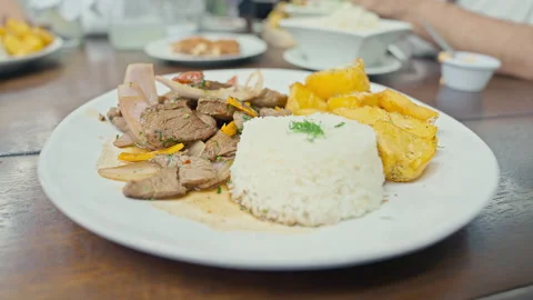 Peruvian Lomo Saltado Dish with Beef Fries and Rice Stock Footage 338341876