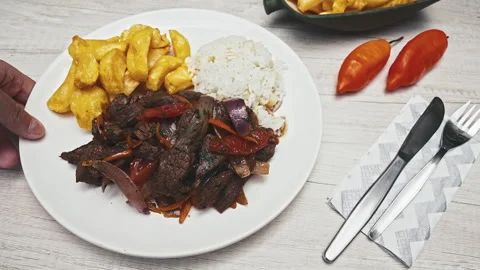Peruvian Lomo Saltado Dish with Beef Fries and Rice Stock Footage 341439216