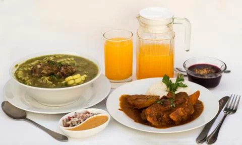 Peruvian lunch menu "estofado", "chaque" (soup+second dish meat). Stock Photos