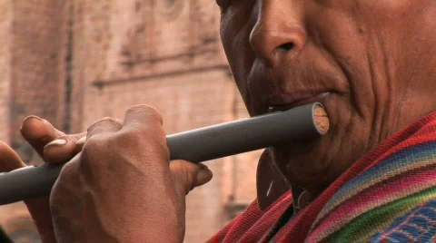 Peruvian man plays flute  Stockbeeldmateriaal 156599