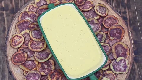 Peruvian purple potato chips served with Huancaina chili sauce Stock Footage 339078430