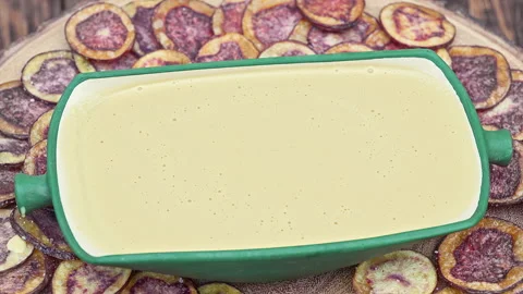 Peruvian purple potato chips served with Huancaina chili sauce Stock Footage 341440625