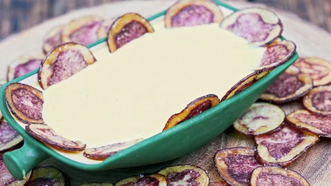 Peruvian purple potato chips served with Huancaina chili sauce Stock Footage 341440669
