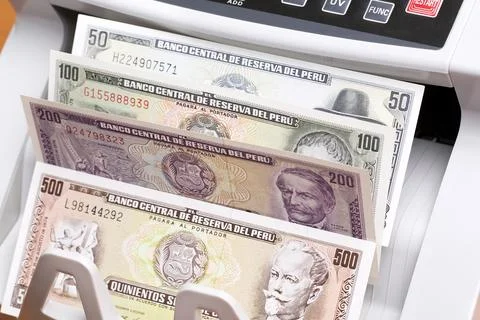 Peruvian sol in the counting machine Stock Photos