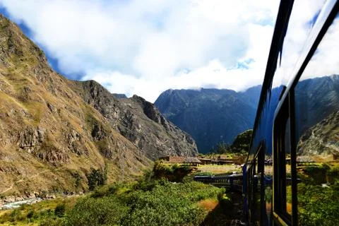 Peruvian train and ancient buildings Stock Photos