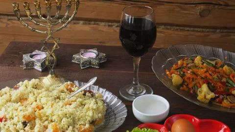 The Pesach Seder table is festively set with matzo candles and wine. Genera.. Video stock 274578571