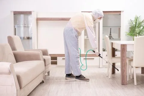 Pest control contractor working in the flat Fotos Stock