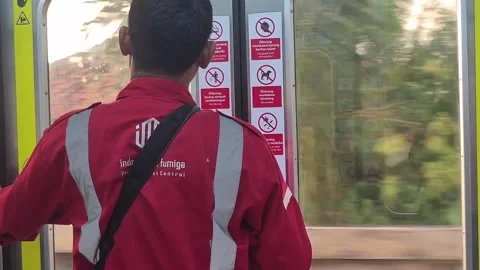 A pest control officer in a red uniform Video stock 338222284