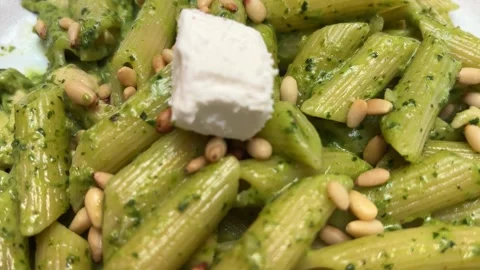 Pesto Pasta with Basil Pine Nuts and Cheese Circular Shot Vídeos de archivo 332259860