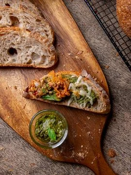 Pesto Sauce with Rustic Sourdough Bread on Wooden Table. Stock-Fotos