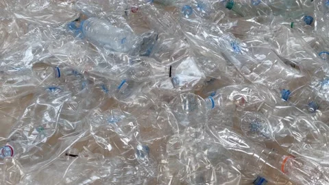 PET bottle recycling. Collected sorted by clear color and crushed plastic water 库存影片 229593289