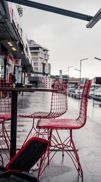  Pet cups on the table and red chairs  Stock Photos