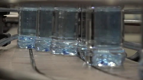 Pet or Plastic Bottles on a factory conveyor belt Stock Footage 239686033