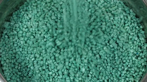 PET Recycled Plastic Raw Polymer Green Granules Falling Stock Footage 123234607