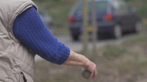 Petanque / Boules Player Throwing Ball in Slow Motion Stock Footage 34319809