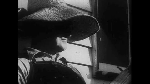 Pete Seeger talks about the banjo in 1946 while we journey to picnics and folk Stock Footage 106908328
