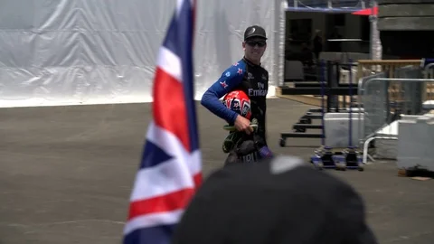Peter Burling waves at supporters during Americas Cup finals. Stock Footage 88274966