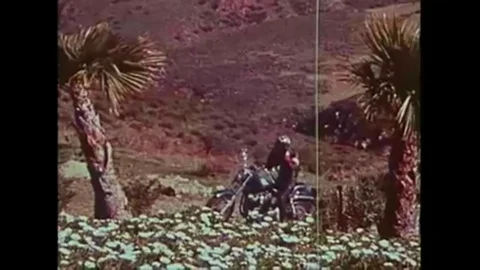 Peter Fonda and Evel Knievel present an introduction to motorcycle safety in Stock Footage