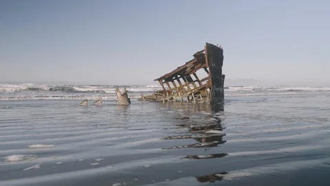 Peter Iredale shipwreck at fort stevens astoria ocean beach tracking forward Stock Footage 127387563
