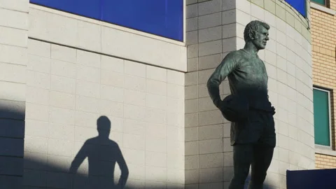 Peter Osgood statue, Stamford Bridge, Chelsea FC, West London UK. Stock Footage