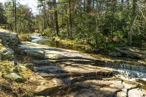 Peter's Kill flows over smooth rock slabs. Stock Photos