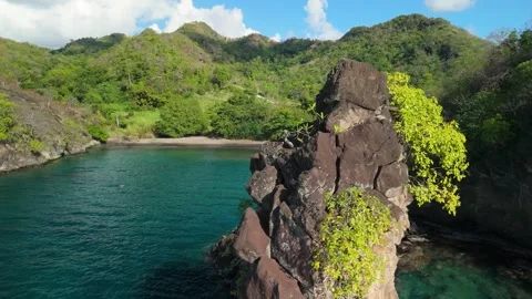 Petit Byahaut sea stack and secluded cove aerial reveal Saint Vincent Stock Footage 344447595