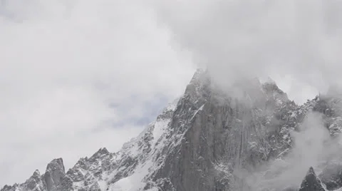 Petit dru west face clouds Stock Footage 24185664