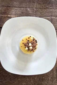 Petit Four Cake Centered on a White Plate, Festive Presentation 스톡 사진