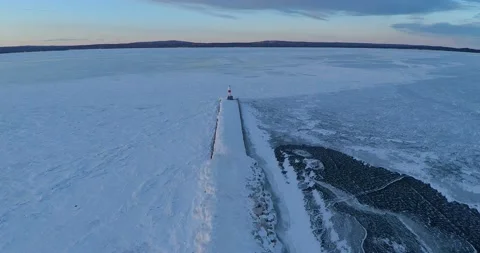 Petoskey Breakwall Lighthouse Ice North Michigan Drone Aerial View Stock Footage 150239444