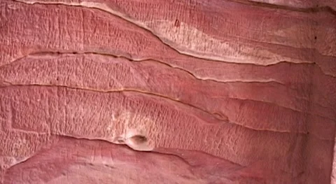 Petra. Jordan. Texture of layers of red sandstone on walls of cave temples. Stock Footage 149300386