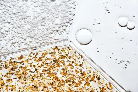 A petri dish with three textures of different serums. Stock Photos