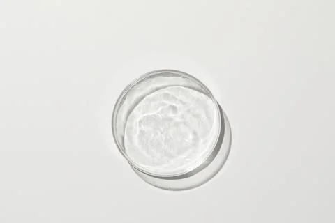 Petri dish with weak ripple 2 in grey background Stock Photos