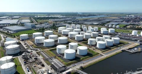 Petrochemical containers, heavy industry, laoding and unloading along the water Stock Footage 244869075