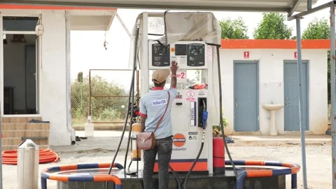 Petrol pump worker setting reading Stock Footage 147677666