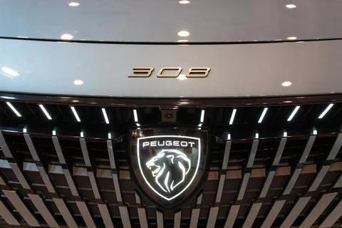 Peugeot e-308 EV front grille and logo close-up at ECAR Show 2026 Stock Photos