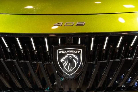 Peugeot e-408 EV front grille and logo close-up at ECAR Show 2026 Stock Photos