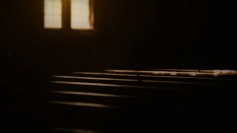 Pews and window in dark. Inside old, historic church; Stock Footage