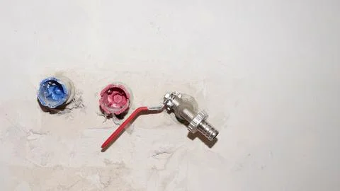 Pex pipe outlets and water tap fitting on wall Stock Photos