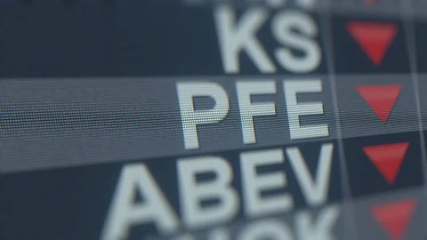 PFIZER PFE stock ticker on the screen with decreasing arrow. Editorial crisis Stock Footage 119528169