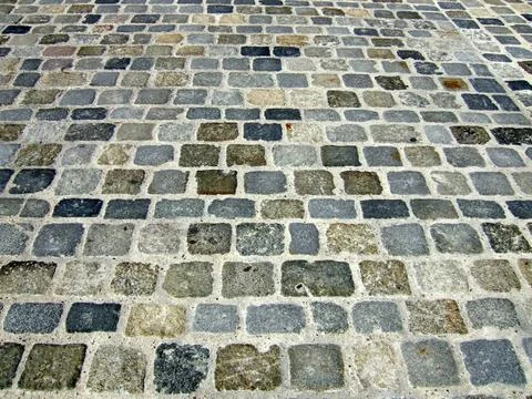  Pflaster aus Granitsteinen bunt, mit Beton verfugt Copyright: xZoonar.com... Stock Photos