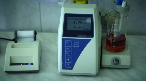 PH analysis of oil or dark lager beer. Research lab assorted glassware equipment Stock Footage 65826502