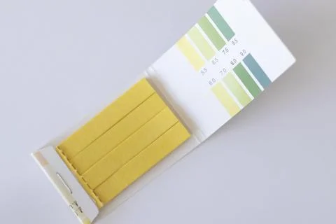 Ph test strips on white background. 5.5 to 9. Stock Photos