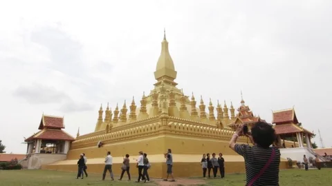 Pha That Luang is a gold-covered large Buddhist stupa in Vientiane, Laos. Stock Footage 75346649
