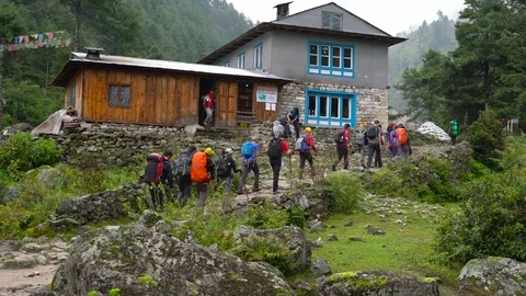 PHAKDING, NEPAL 11 SEPTEMBER 2017 : Trekkers Walking on Phakding Village , Ev Stock Footage 84751656