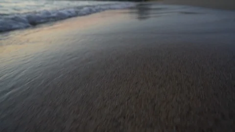 Phalasarna beach sunset reflection mountain waves in with camera tilting up Stock Footage 97851448