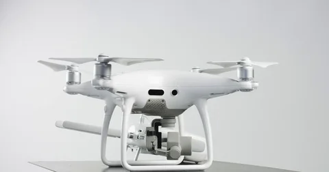 Phantom 4 and a remote controller on a turning platform Stock Footage 76995428