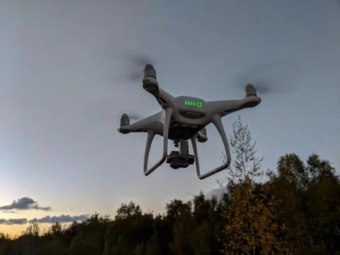 Phantom 4 drone flying at sunset Stock Photos