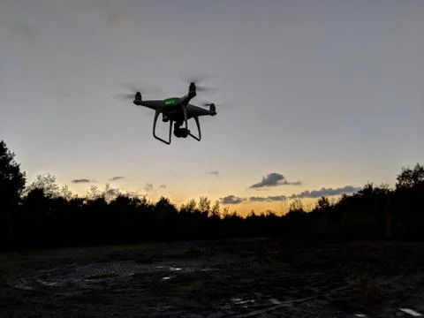 Phantom 4 drone silhouette at sunset Stock Photos